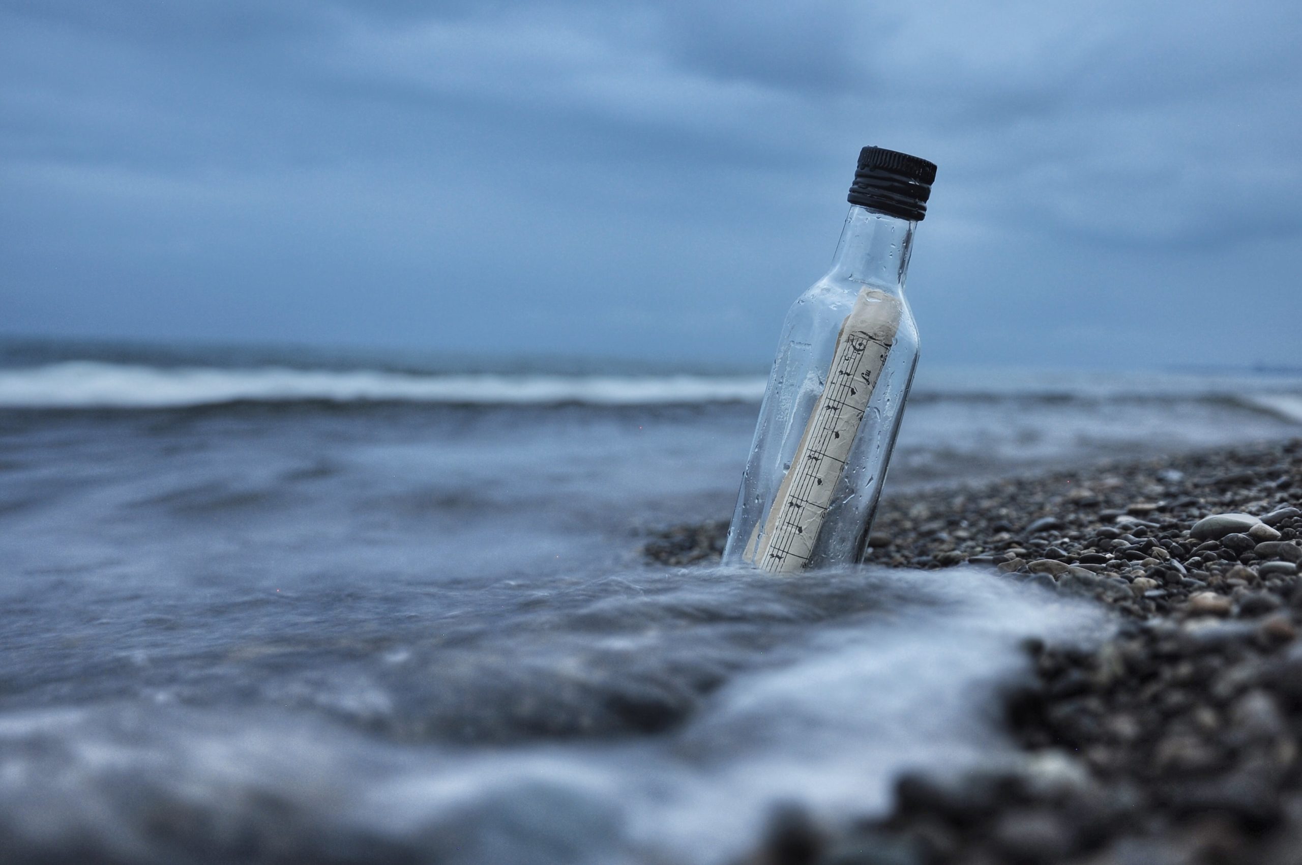 message in a bottle on the beach shore
